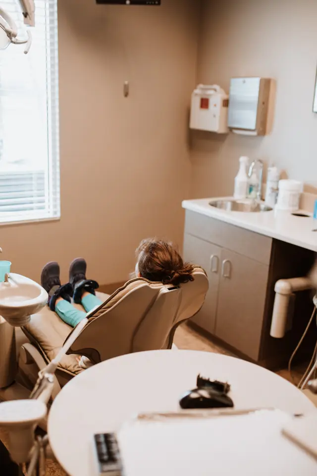 A Defiance Dental Group treatment room with the chair reclined and the light raised